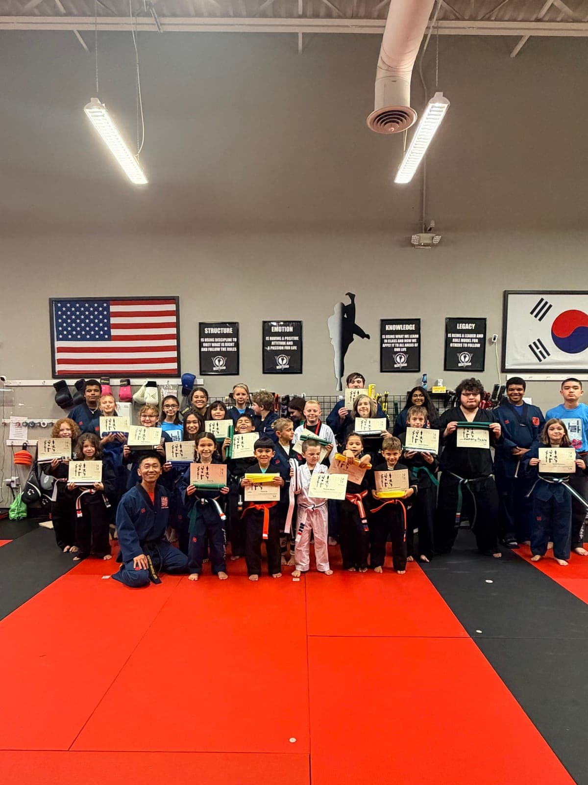 NEXTStep students celebrate an achievement at the Gettysburg dojang